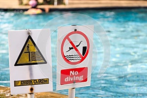 Close up of signs in swimming pool