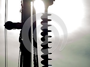 Close-up Silhouette of Excavator hydraulic drilling machine at a Construction site.