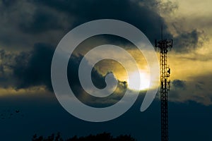 Close up silhouette telephone pole have ove sunlight in the dawn