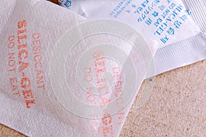 Close up silica gel or desiccant in paper bag background