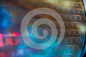 Close up of a silicon wafer of SIM computer chips.