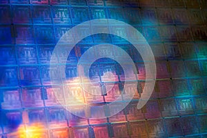 Close up of a silicon wafer of SIM computer chips.