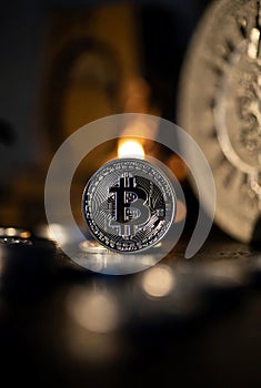 Close-up of Silver Bitcoin Cryptocurrency Coin with Bokeh Background