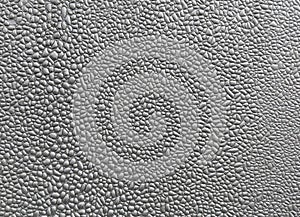 Close-up of silver blistered paint texture.