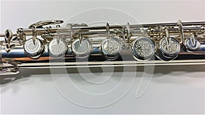 Close-Up of a Silver Flute with Intricate Keywork