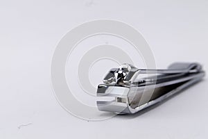 Close-up of Silver Nail Clipper on White Background, Manicure Tool
