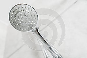 Close Up Of Silver And White Shower Head