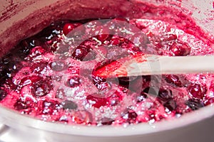 Close up of simmering homemade cherry jam
