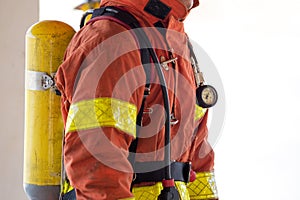 close up single fireman in fire fighting protection suit and equipment