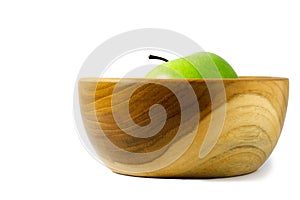 Close up single green Apple granny smith above wooden bowl / basket isolated on white background