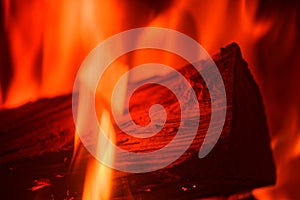 Close-up of single log in red fire flames