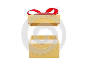 close up single open empty gold gift box with red ribbon bow (lid floating) isolated on white background