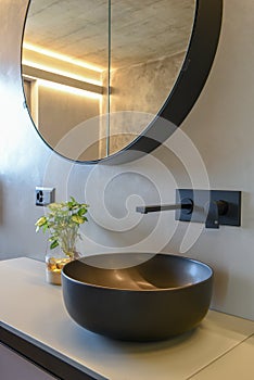 Close up of a sink on a elegant modern bathroom