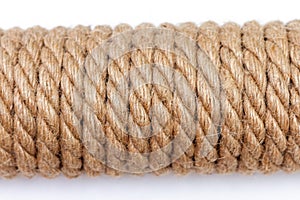 Close-up of sisal rope on white background. Top view, selective focus