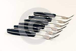 Close up six forks isolated on white background