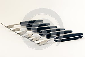 Close up six forks isolated on white background