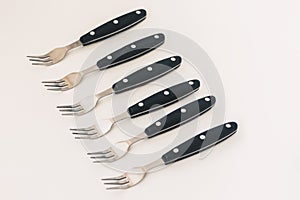 Close up six forks isolated on white background