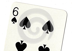 Close up of a six of spades playing card.