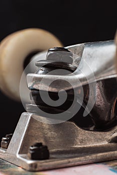 Close up of skateboard parts on black background