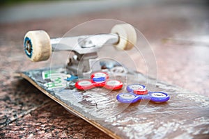 Close-up of skateboard and spinners photo