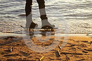 Close-up of the skateboarders feet