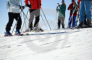 Close up of skiers on piste