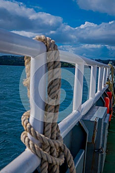 Close up of slective focus of rope in a fenc inside of the ferry in Lemuy Island in Chiloe photo