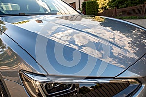 Shiny reflective car hood surface photo