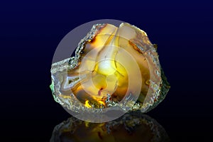 Close up of a Slice Agate Gemstone on dark background