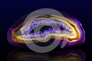 Close up of a Slice Agate Gemstone on dark background, close up