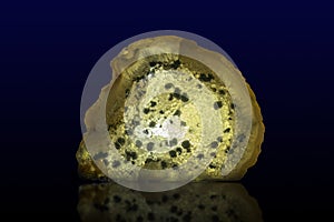 Close up of a Slice Agate Gemstone on dark background, close up