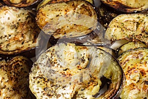 Close-up of a slice of eggplant cooked with spices.