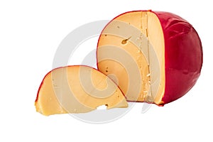 Close up. Sliced Head of Cheese Edam. Isolated on white wooden background