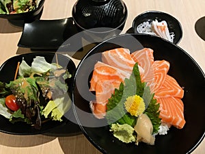 Sliced salmon don with Japanese rice and salad for health