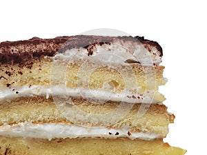 Close up of sliced tiramisu flavored sponge cake isolated cut out on white, layered of coffee fluppy cakes with whipped cream and