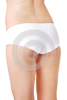 Close up on slim woman buttocks in underwear