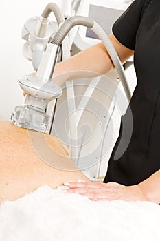 Close-up of slimming vacuum massage treatment at clinic
