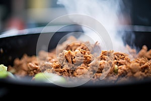 close-up of sloppy joe meat, steam rising