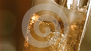Close-up slow-motion Cold Light Beer in a glass with water drops on bar background. Craft Beer close up. Microbrewery