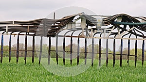 Close up of a slurry spreader dribble bar in a field. UK