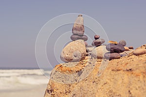 Close-up of Small Cairns by the Ocean
