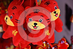 Close-up of small hanging Tiger cub toys with suction cups to usher in the Chinese Year of the Tiger in 2022