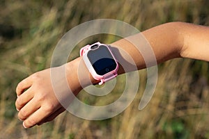 Close up smart watch on child& x27;s arm