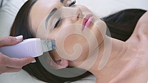 Close up of smart woman on procedure in beauty parlor