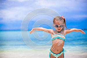 Close-up smile painted by sun cream on little girl