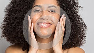 Close up smiling african american woman with perfect skin.