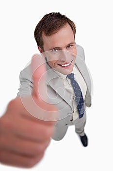Close up of smiling businessman giving thumb up