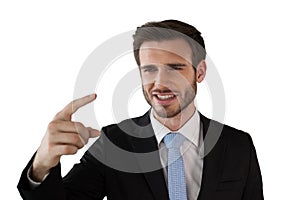 Close up of smiling businessman looking while touching on interface
