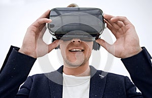 Close up.smiling businessman in virtual reality helmet