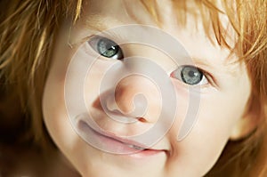 Close-up of smiling child face